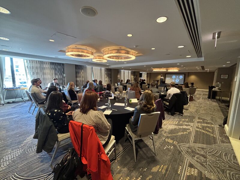 Addepar community meetup attendees in discussion around tables in Chicago